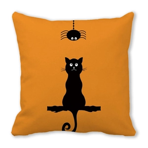Detailed close-up of orange Halloween cushion cover featuring black cat and spider silhouette