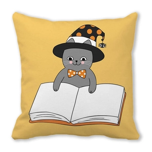 Detailed view of Halloween pillowcase featuring a cartoon cat reading a magic book