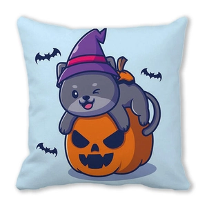Detail of Halloween pillowcase featuring grey cat with wizard hat and orange pumpkin