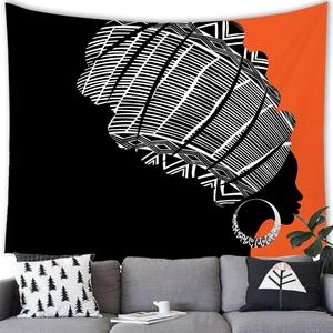 Detail view of African woman wall tapestry in modern ethnic style hanging over a sofa
