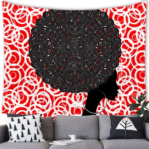 Detailed view of African woman silhouette tapestry above a modern grey sofa in a living room