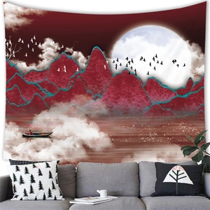 Detail view of a landscape tapestry with red mountains and moon in a modern living room