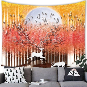 Artistic white deer tapestry with tree antlers over a gray sofa in a modern living room