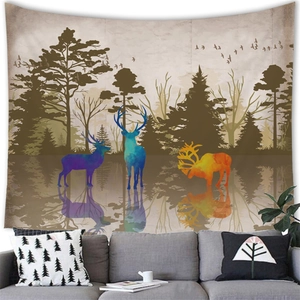 Artistic forest tapestry with deer silhouettes hanging above a modern sofa in a living room