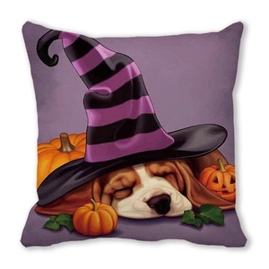 Detail of Halloween pillow case with sleeping beagle dog in witch hat and pumpkins