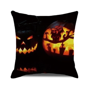 Detail of Halloween pillowcase with glowing jack-o-lantern and owl on black fabric