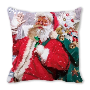 Detail of Christmas pillow cover showing vibrant Santa Claus watercolor painting and fabric texture