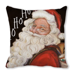 Close-up of Santa Claus watercolor print on soft pillowcase with HO HO HO text