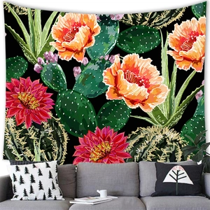Detail of floral cactus tapestry showing vibrant orange flowers on a black fabric backdrop