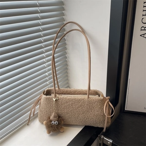 Winter plush tote bag in light brown faux lamb wool with leather straps and monster charm