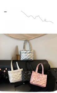 Quilted puffer tote bags in metallic silver, white, black, and pink with diamond stitching