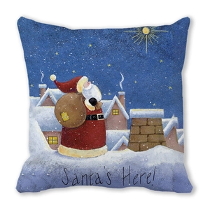 Detail of Christmas pillow featuring Santa illustration and Santa's Here text