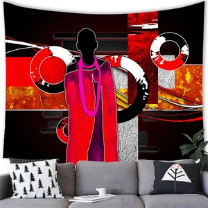 Abstract African woman wall tapestry in red and black over a modern gray sofa