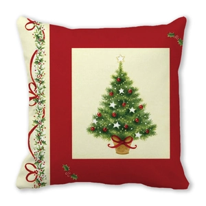 Close-up of a Christmas pillowcase featuring a green tree and festive red decorations