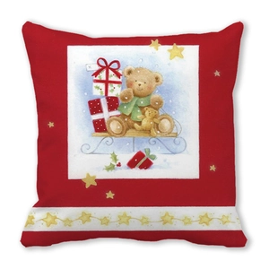 Detail of Christmas pillow cover featuring a hand-drawn teddy bear and festive sled design