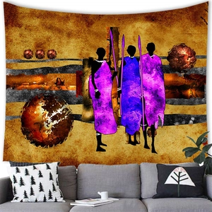Detail of African abstract wall tapestry hanging above a modern sofa in a living room
