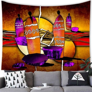 Detailed view of African abstract tapestry hung above a modern sofa in a living room