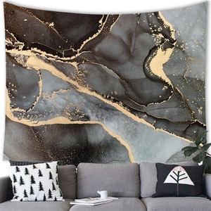 Detail of modern marble wall tapestry with golden elements above grey fabric sofa