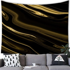 Detail of modern black and gold marble texture tapestry hanging above a grey sofa