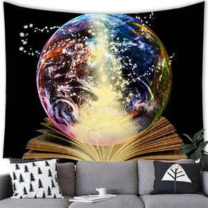 Magic book and galaxy tapestry wall hanging for fantasy home decor above a gray sofa