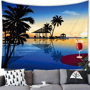 Detail of tropical sunset beach tapestry with palm silhouettes over a gray fabric sofa