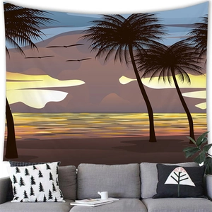 Detail of tropical sunset beach tapestry hanging above a modern sofa for home decor