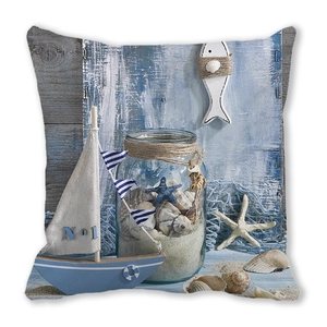 Close-up of peach skin pillowcase with nautical sailing boat and seashell patterns