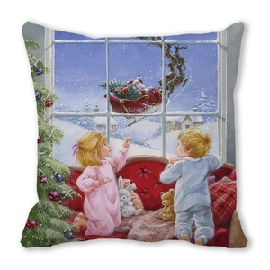 Close-up of Christmas pillow cover featuring children watching Santa Claus and reindeer
