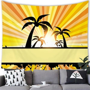 Tropical sunset tapestry with palm tree silhouette hanging over a modern grey sofa