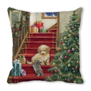 Detail of Christmas cushion cover with golden puppy and gray kitten by a tree