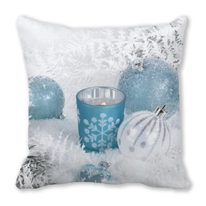 Detail of Christmas pillowcase with blue and white ornaments on soft peach skin fabric