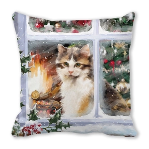 Detail of Christmas throw pillow featuring a calico cat at a snowy window with fireplace