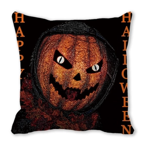 Macro detail of Halloween pillow case with orange pumpkin grin and Happy Halloween text