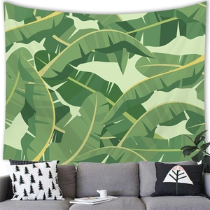 Tapisserie murale feuilles de bananier tropicales sur un canapé moderne de salon