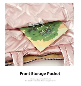 Close-up of pink quilted puffer tote bag front pocket with a book showing storage capacity