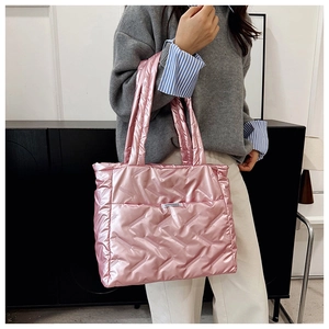 Detail of pink quilted down tote bag with metallic finish and Fashion&Bag label