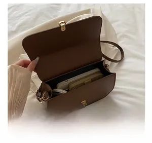 Internal view of brown leather saddle bag showing large capacity for essentials