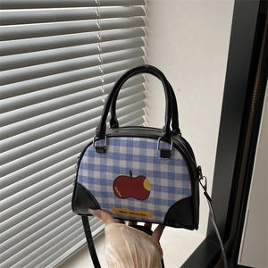 Blue and white checkered mini bowling bag with red apple print and black leather straps