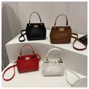 Litchi pattern leather handbags in multiple colors with elegant gold twist lock detail