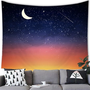 Detail of colorful starry sky and sunset landscape tapestry hanging on a gray sofa wall