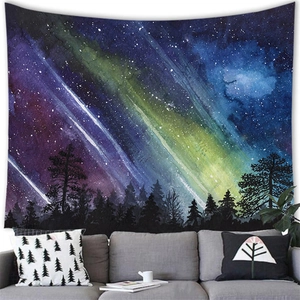 Artistic aurora starry sky wall tapestry over a grey sofa in a modern living room decor
