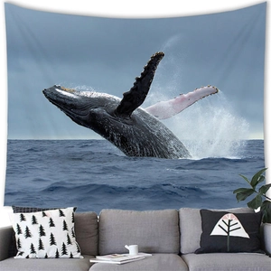 Wall tapestry featuring a majestic humpback whale jumping out of blue ocean water