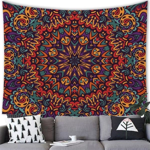 Detail of bohemian mandala tapestry featuring colorful geometric patterns on a living room wall