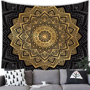 Detailed view of bohemian mandala tapestry hanging above a grey sofa for home decor