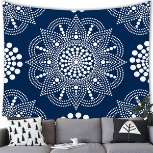 Detailed close-up of large blue mandala tapestry with white dot pattern on modern wall