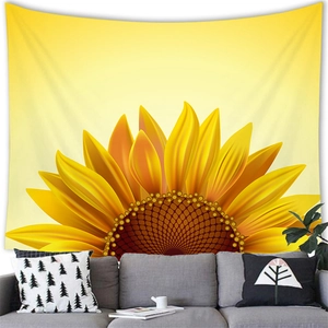 Floral watercolor sunflower wall tapestry hanging above a modern grey sofa backdrop
