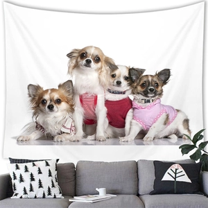 Detail of watercolor pet dogs tapestry hanging above a grey sofa in a modern room