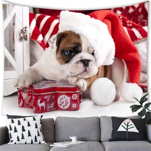 Detail view of bulldog puppy Christmas tapestry hung above a sofa for holiday home decor