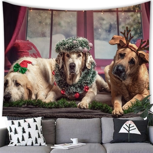 Macro detail of Christmas wall tapestry featuring three festive dogs above a modern sofa