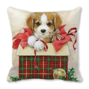 Vue détaillée du coussin de Noël chiot avec illustration festive de boîte-cadeau